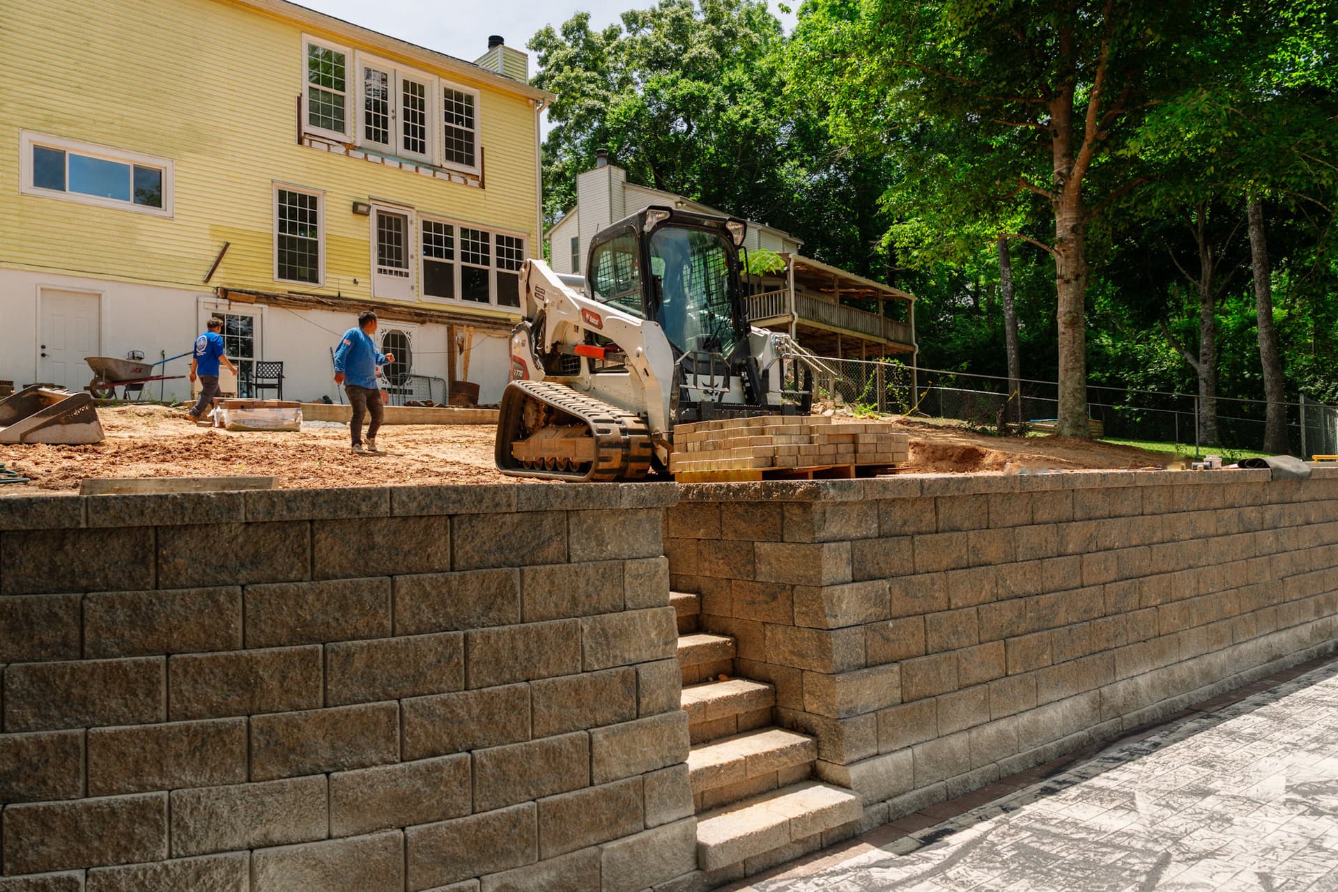 Tiered Retaining Walls Setting the Stage for a Lakeview Paver Patio image
