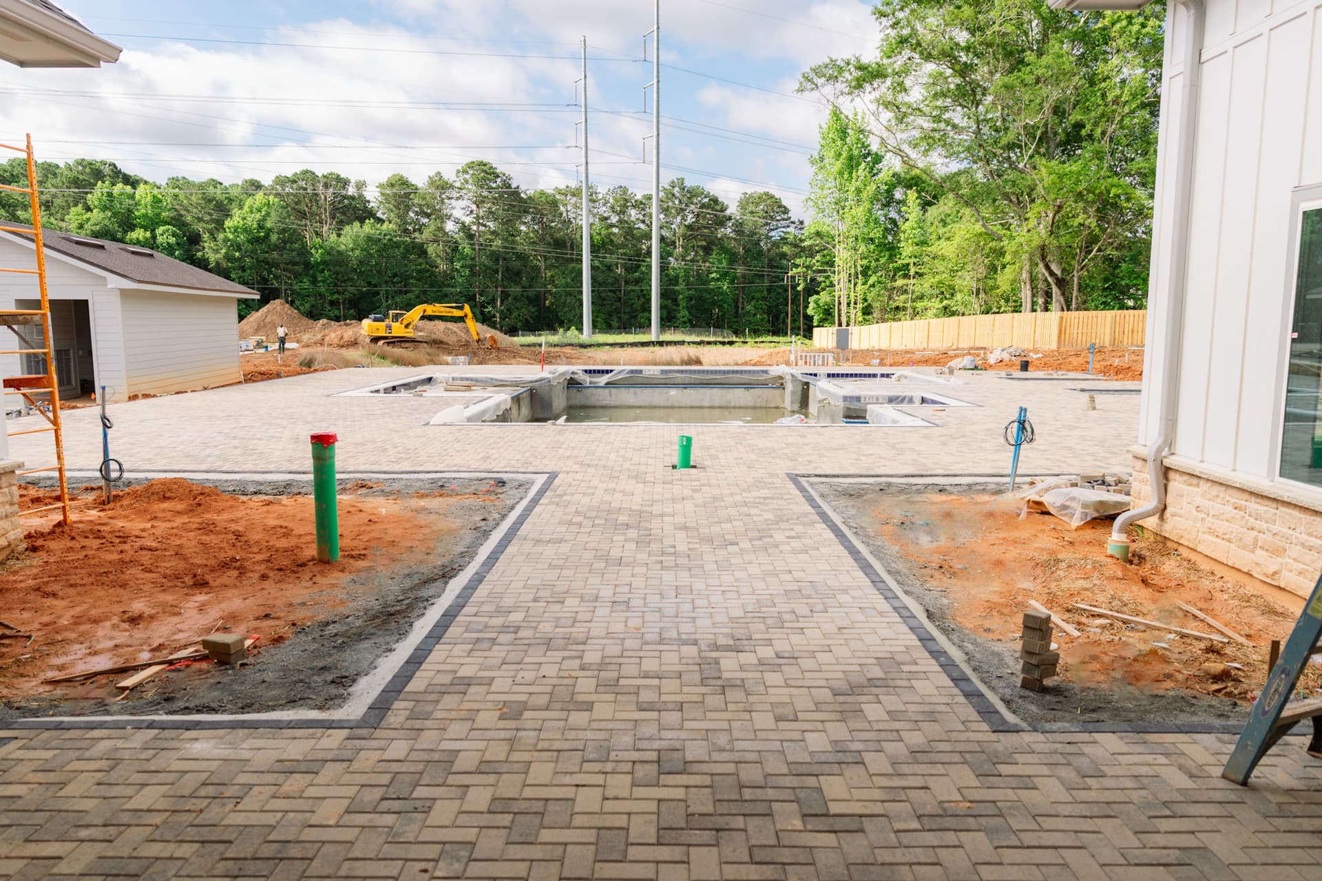 Poolside Paver Install Taking Shape at This Complex image