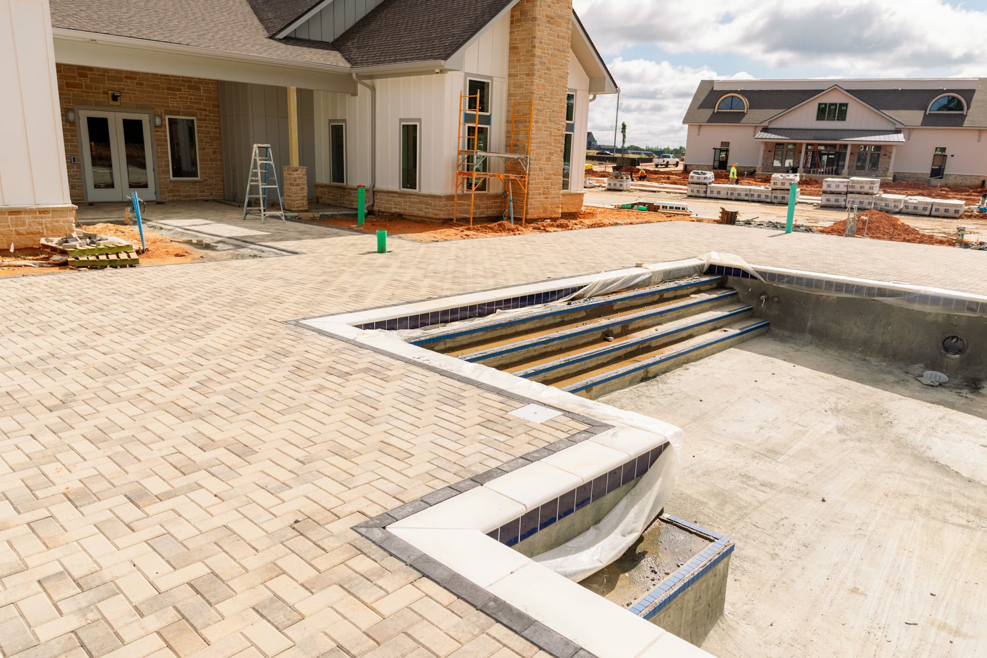 Gallery photos for Poolside Paver Install Taking Shape at This Complex: Image #1